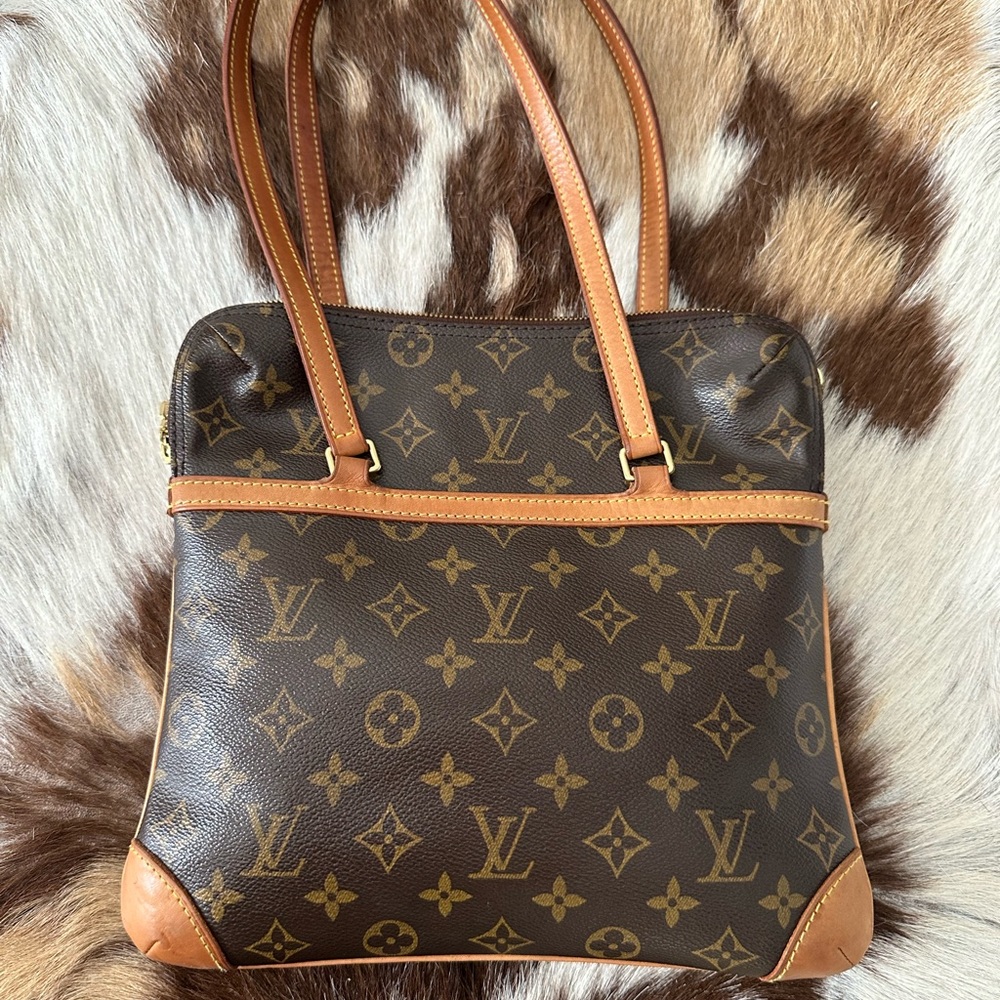 Authentic Louis Vuitton Handbag with red velvet lining.